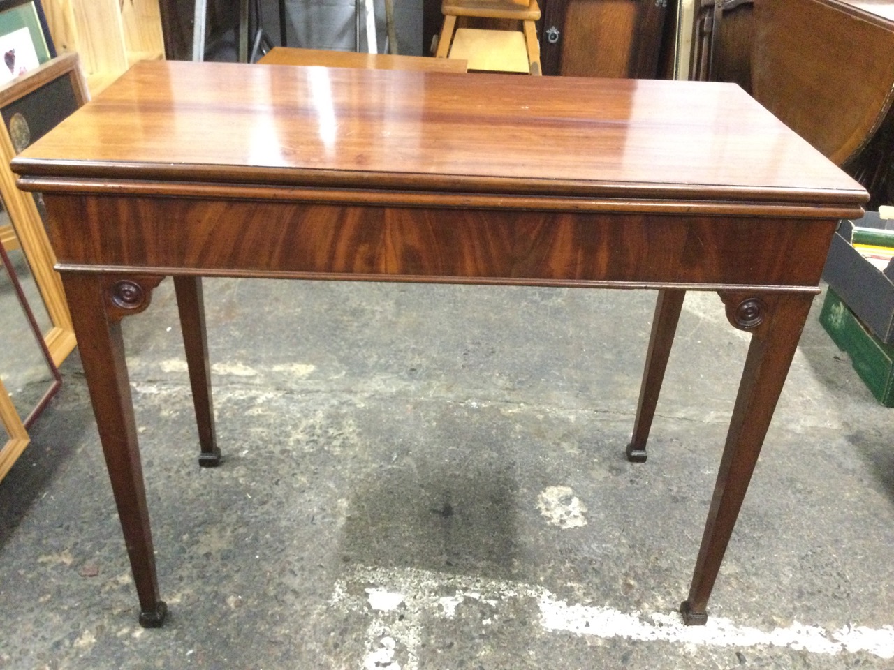 A Georgian mahogany fold-over card table with moulded rectangular top on swing legs enclosing a - Image 3 of 3