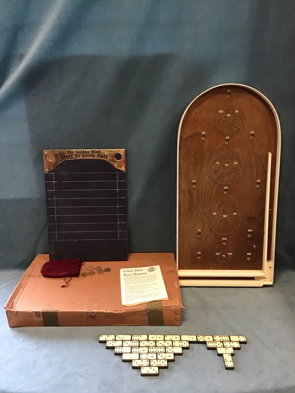 A boxed Golden Hind slate & brass shove ha’penny board with halfpennies and rules; a bagatelle