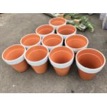 Ten tapering traditional teracotta flower pots with while painted bands to rims. (12.25in) (10)