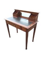 An Edwardian mahogany writing desk with raised back having central mirror flanked by stationery