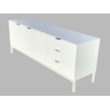 A contemporary white lacquered sideboard, the rectangular top above two cupboards and three drawers,