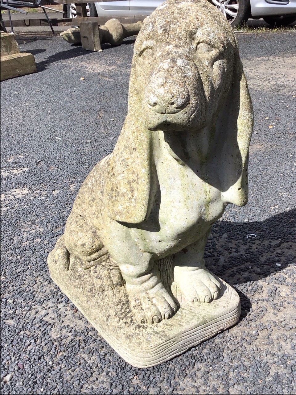 A composition stone basset hound, the animal seated on plinth. (20in) - Image 2 of 3