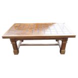 A contemporary walnut coffee table, the rectangular top inlaid with marquetry tile style panels