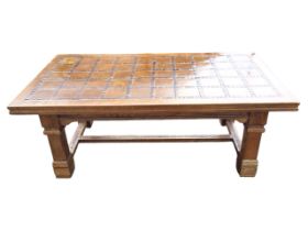 A contemporary walnut coffee table, the rectangular top inlaid with marquetry tile style panels
