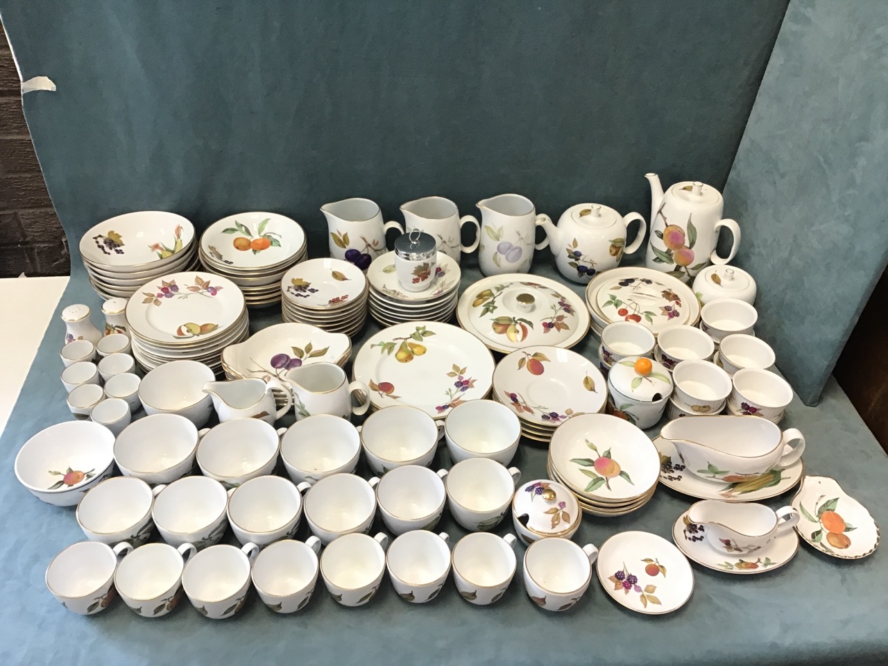 An extensive Royal Worcester service in the Evesham pattern - cups, saucers, teaplates, bowls,