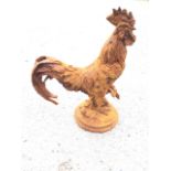 A rusty cast iron model of cockerel, raised on circular moulded base. (16.5in)
