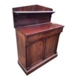 A William IV mahogany chiffonier, the pedimented back with shelf and rectangular top above a