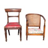 A 20s beech low armchair with horseshoe shaped caned back and arms on turned supports with