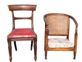 A 20s beech low armchair with horseshoe shaped caned back and arms on turned supports with