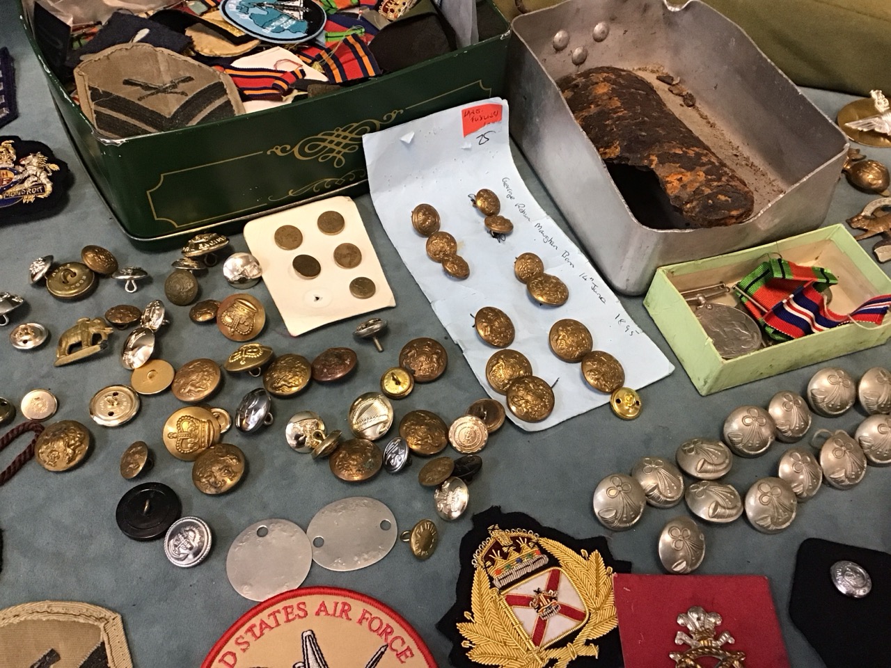 Miscellaneous militaria including cloth badges & insignia, uniform buttons, a shell fragment, WWII - Image 2 of 3