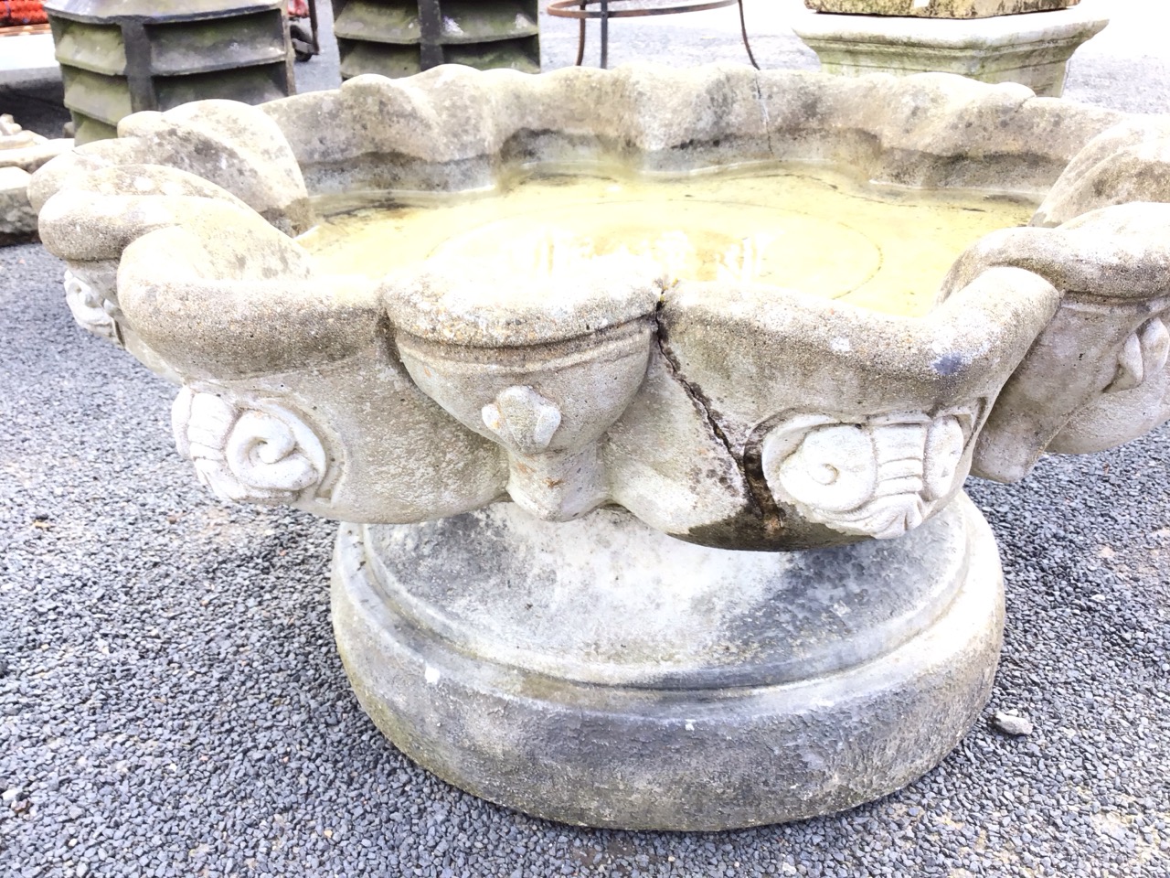 A circular composition stone garden birdbath, the scalloped bowl cast with scrolled shell medallions - Image 3 of 3