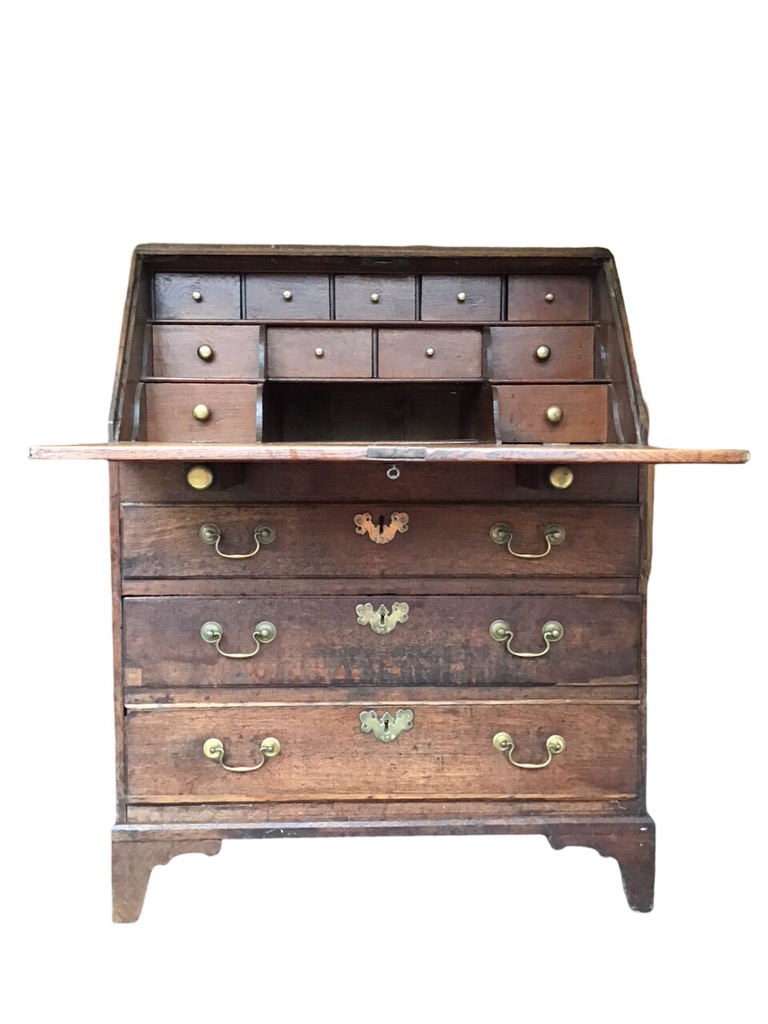 A Georgian oak bureau with rectangular sloping front opening on brass knobbed lopers enclosing - Image 2 of 3