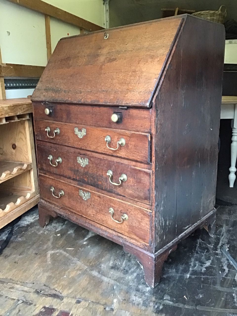 A Georgian oak bureau with rectangular sloping front opening on brass knobbed lopers enclosing - Image 3 of 3
