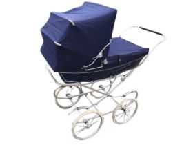 A Mothercare traditionally styled pram, the lined body with folding canvas hood, on a chromed