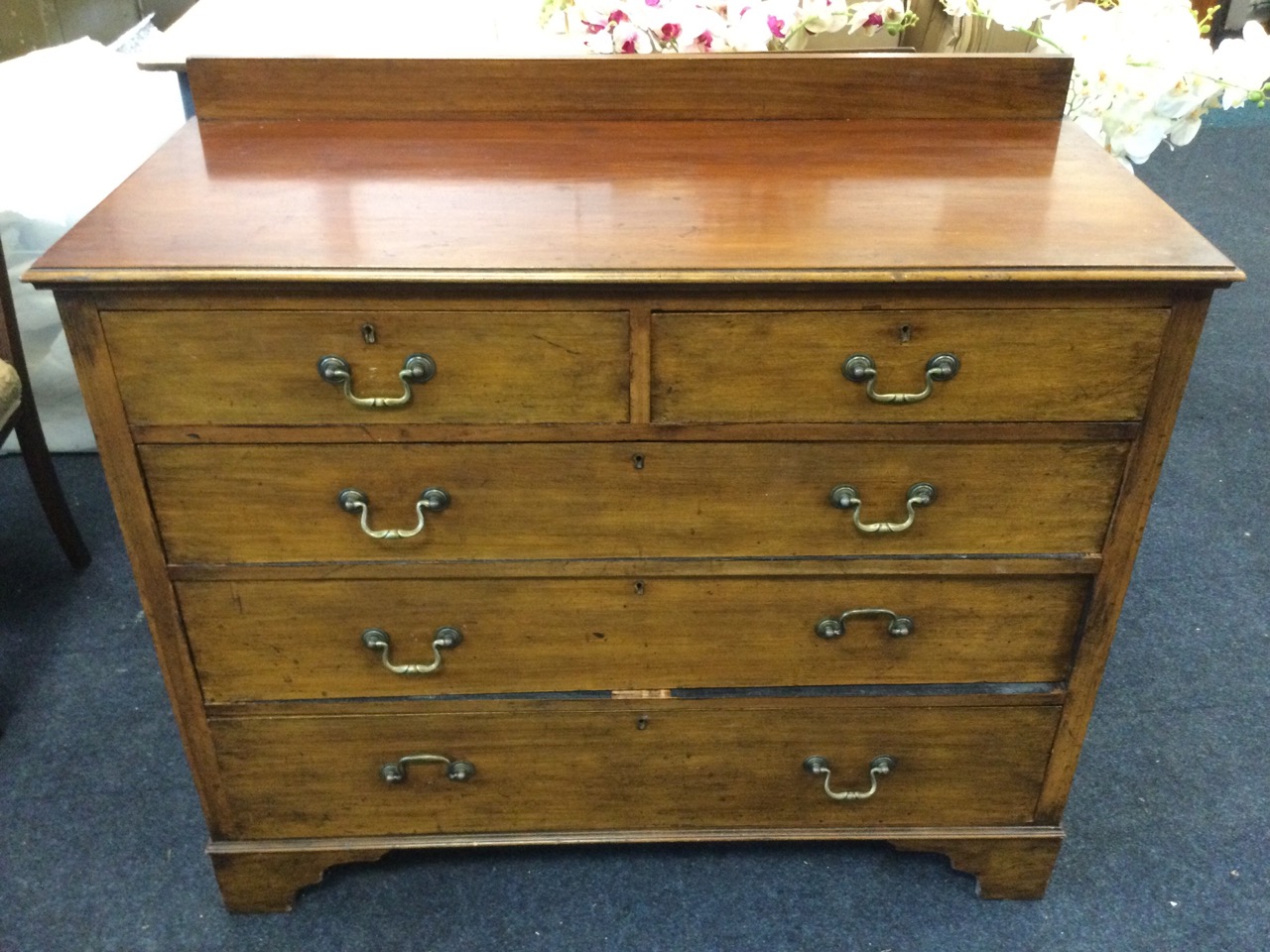 An Edwardian mahogany chest of drawers, with low back to the moulded top above two short & three - Image 2 of 3