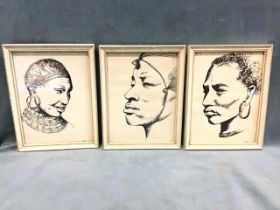 Three pen and ink portrait head studies of African people in traditional dress, monogrammed SP,