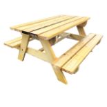 A garden bench table with rectangular plank top on angled supports flanked by integral batten seats.
