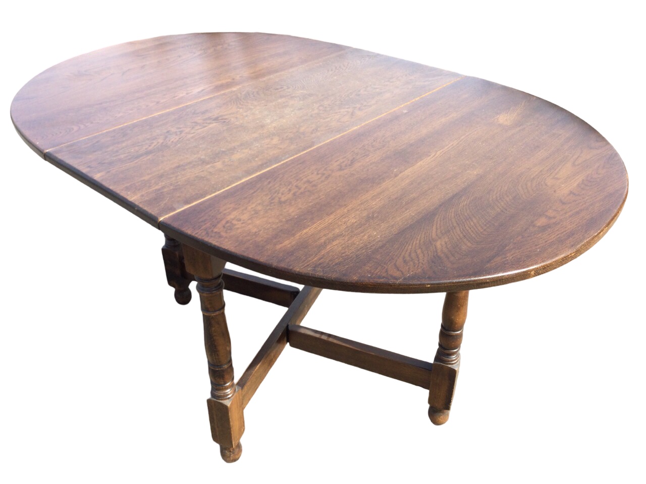 A Jaycee oval oak dining table with two leaves opening on gatelegs, raised on baluster turned - Image 2 of 3