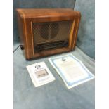 A 50s walnut cased Pye valve radio - model P75T with glass dial beneath fabric covered speaker,