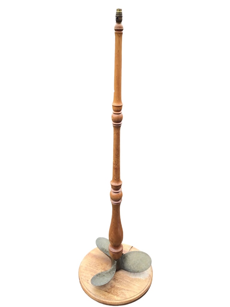 A novelty elm standard tamp with bronze propeller to base above circular platform,