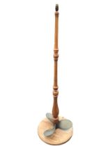 A novelty elm standard tamp with bronze propeller to base above circular platform,