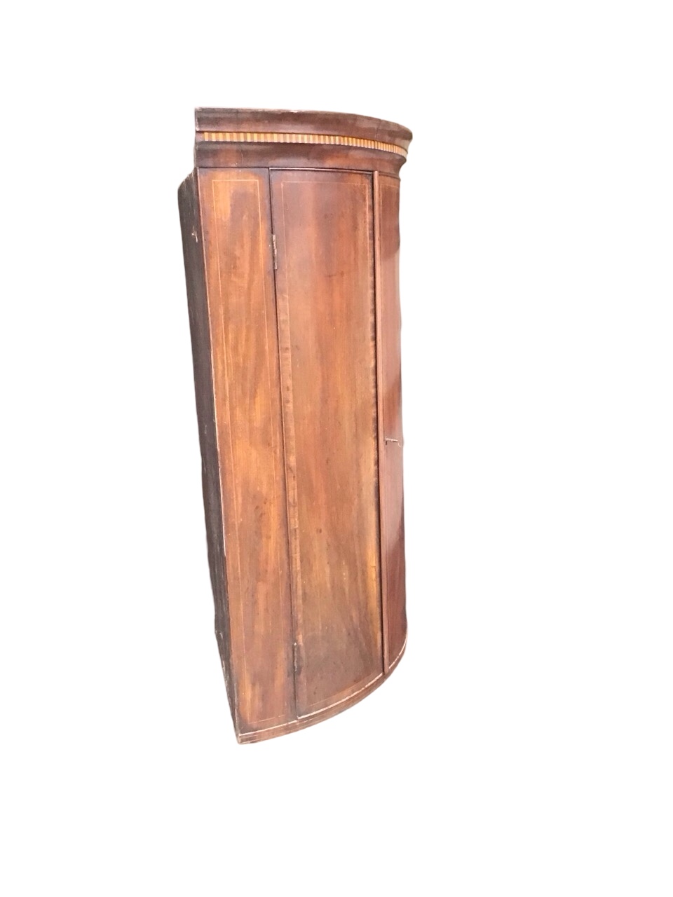 A Georgian mahogany bowfronted hanging corner cabinet with dentil inlaid cornice above a pair of - Image 2 of 3