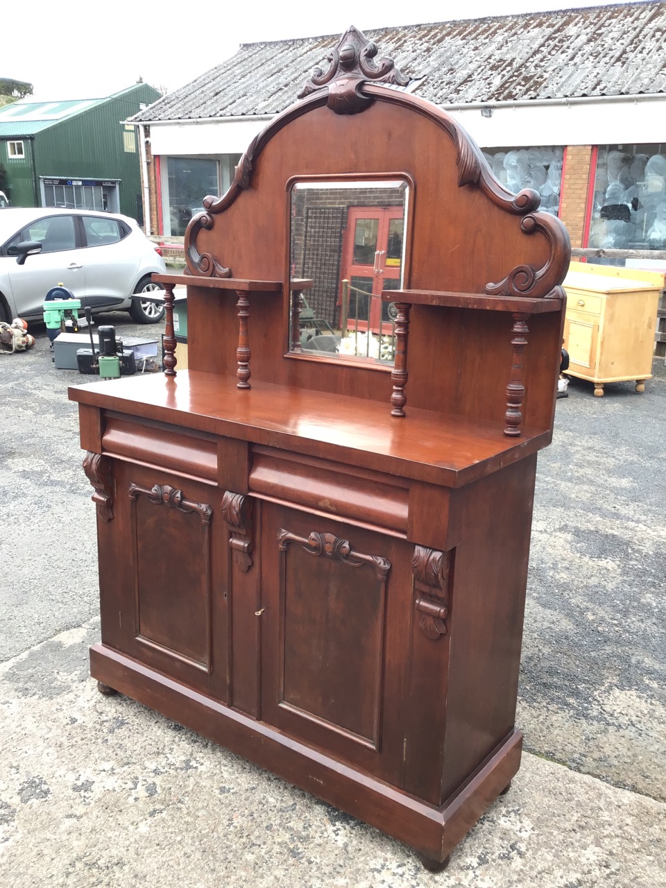 A Victorian mahogany chiffonier with arched scroll carved back having central mirror flanked by - Image 3 of 3