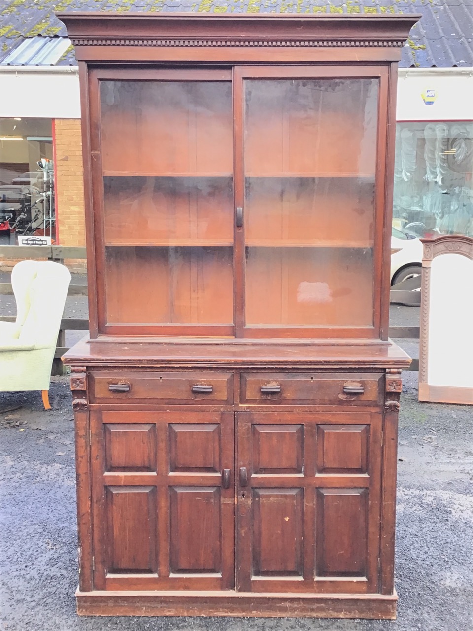 A Victorian stained bookcase cabinet with dentil cornice above a pair of sliding glass doors - Image 2 of 3