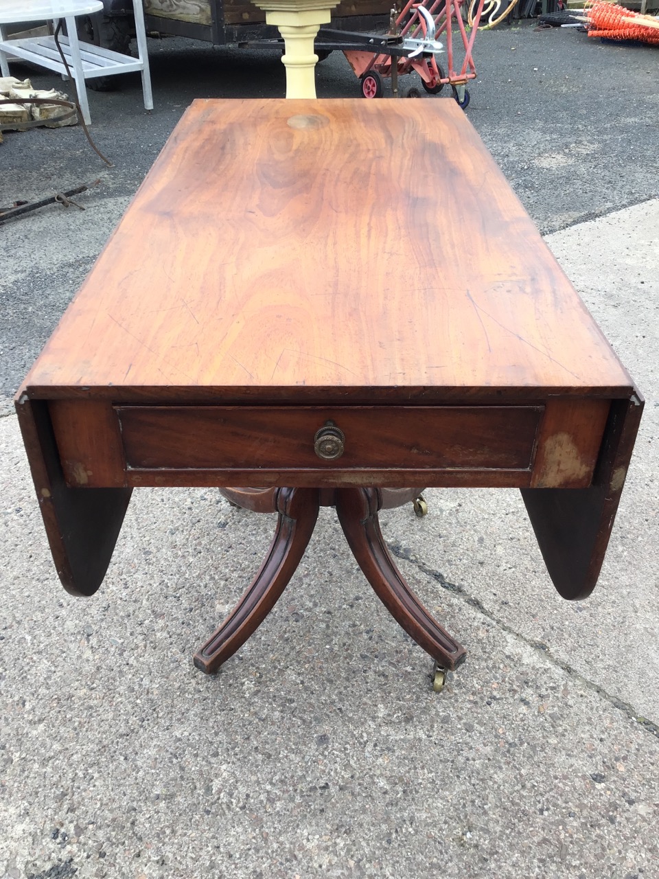 A regency mahogany dining table with rounded rectangular top and two leaves supported on brackets - Image 3 of 3