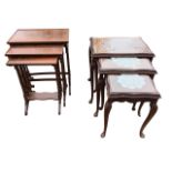 A mahogany nest of three rectangular tray-top tables, each with six ringed turned legs on shaped