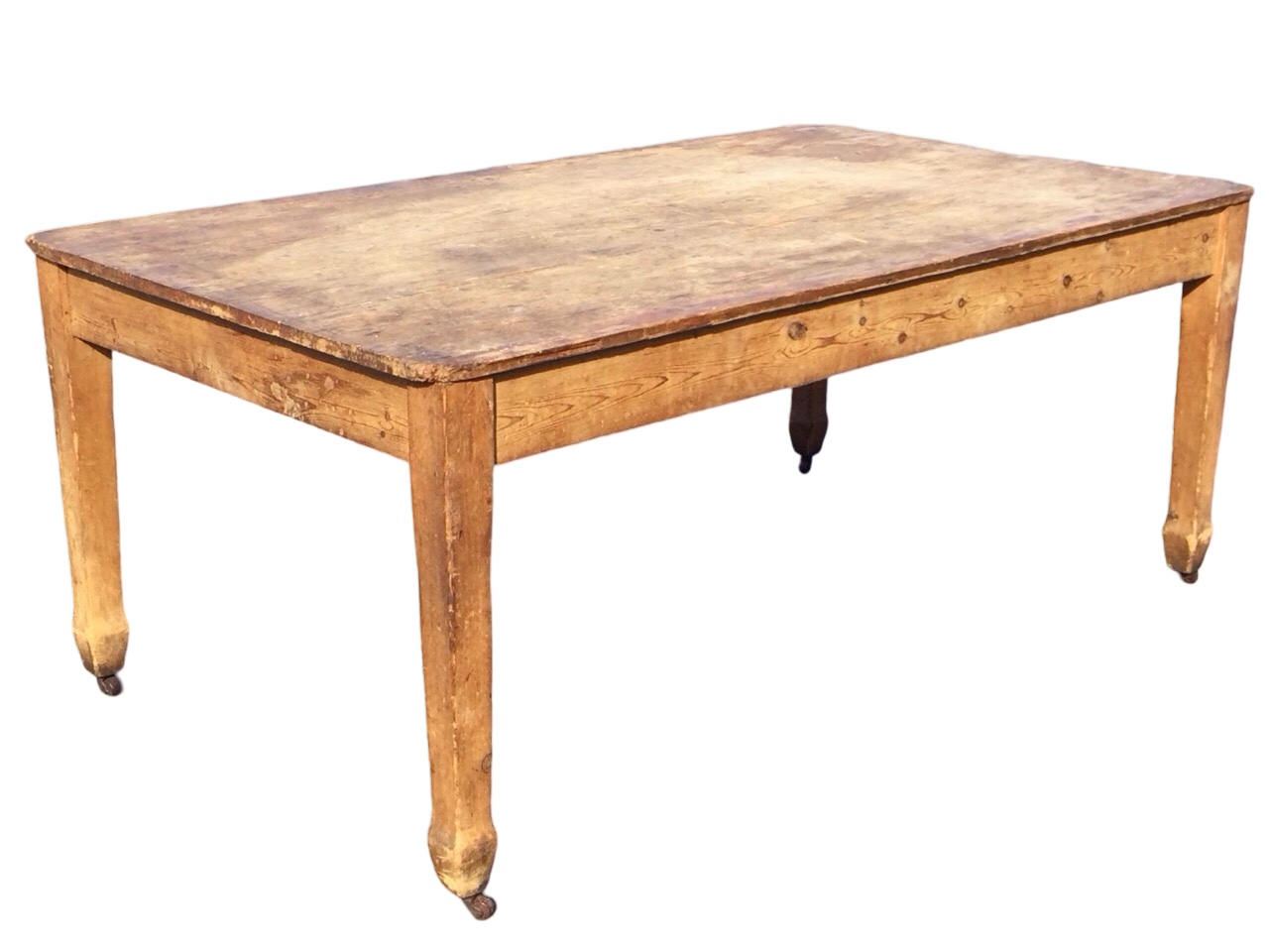 A large Edwardian pine kitchen table with rectangular top above a plain frieze, raised on square