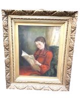 An Edwardian oil on canvas, portrait of a young girl in red dress seated by a window reading a