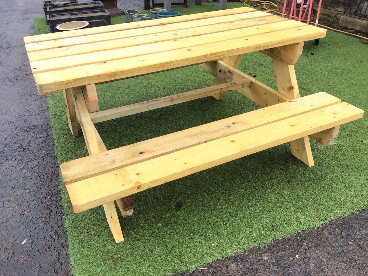 A garden bench table with rectangular plank top on angled supports flanked by integral batten seats. - Image 3 of 3