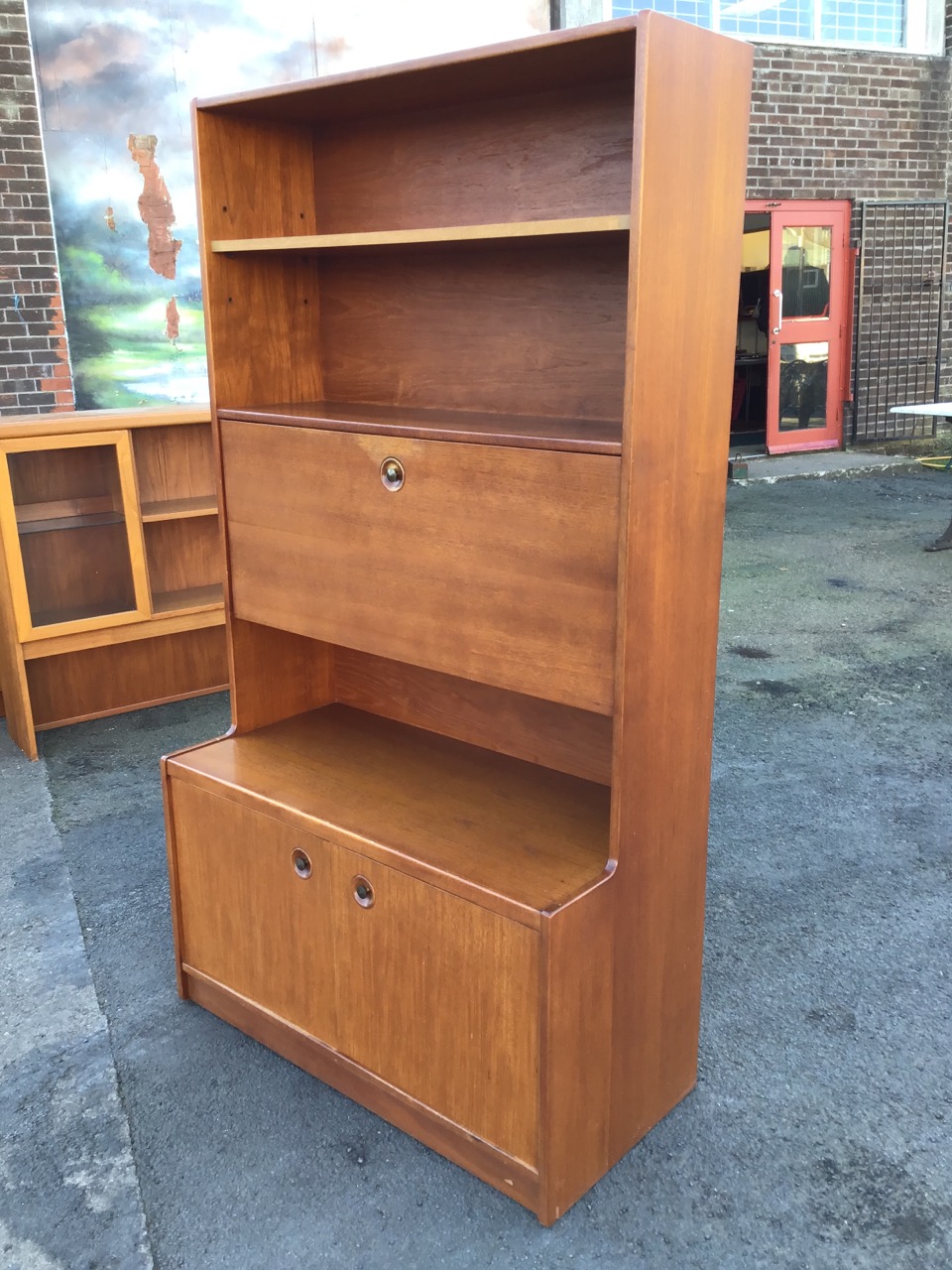 A 1970s teak bureau bookcase with rectangular open-shelf top above a fall-front desk with recessed - Image 3 of 3