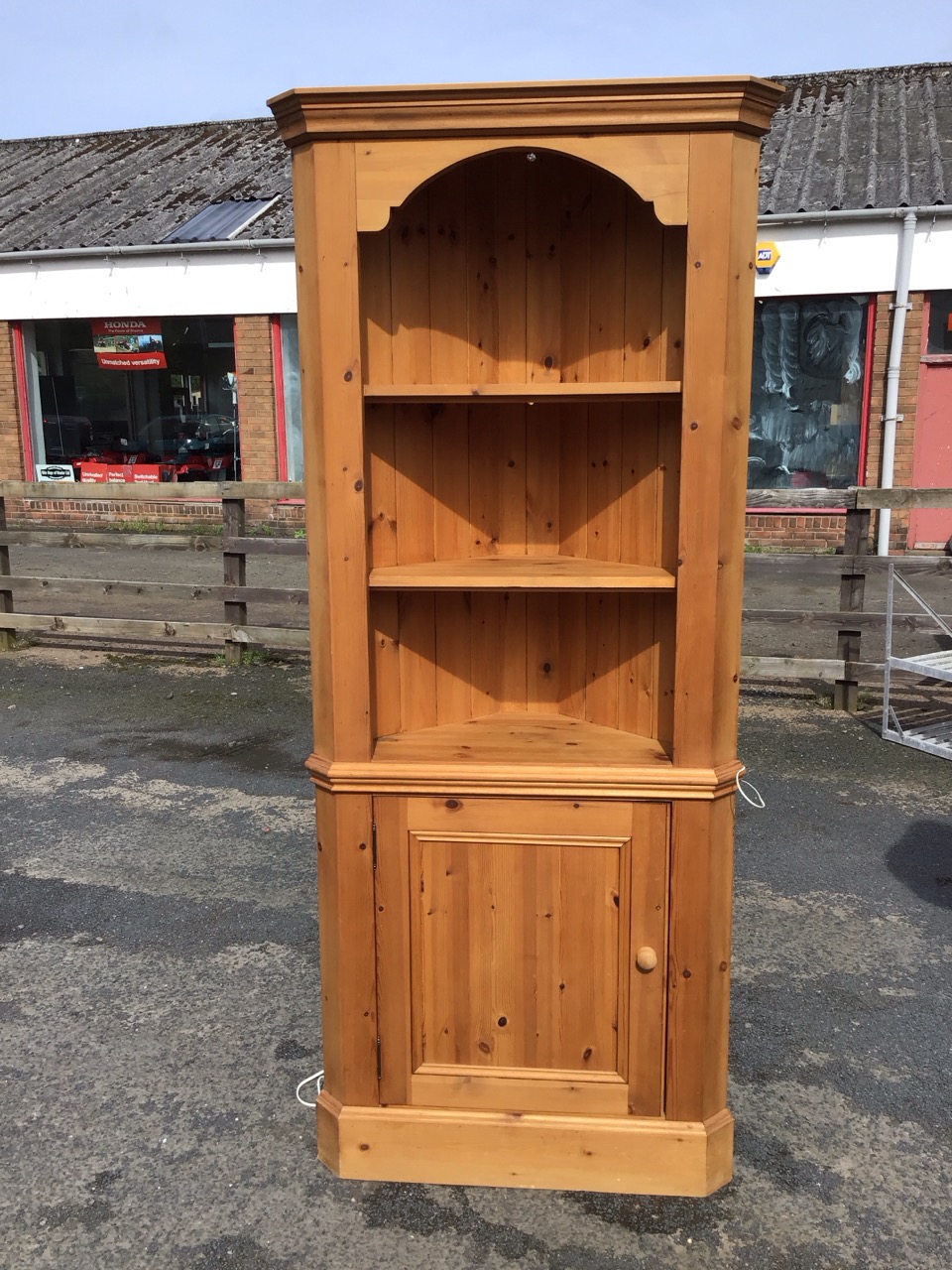 A Victorian style pine corner cabinet with moulded cornice above open shelves and a knobbed - Image 3 of 3