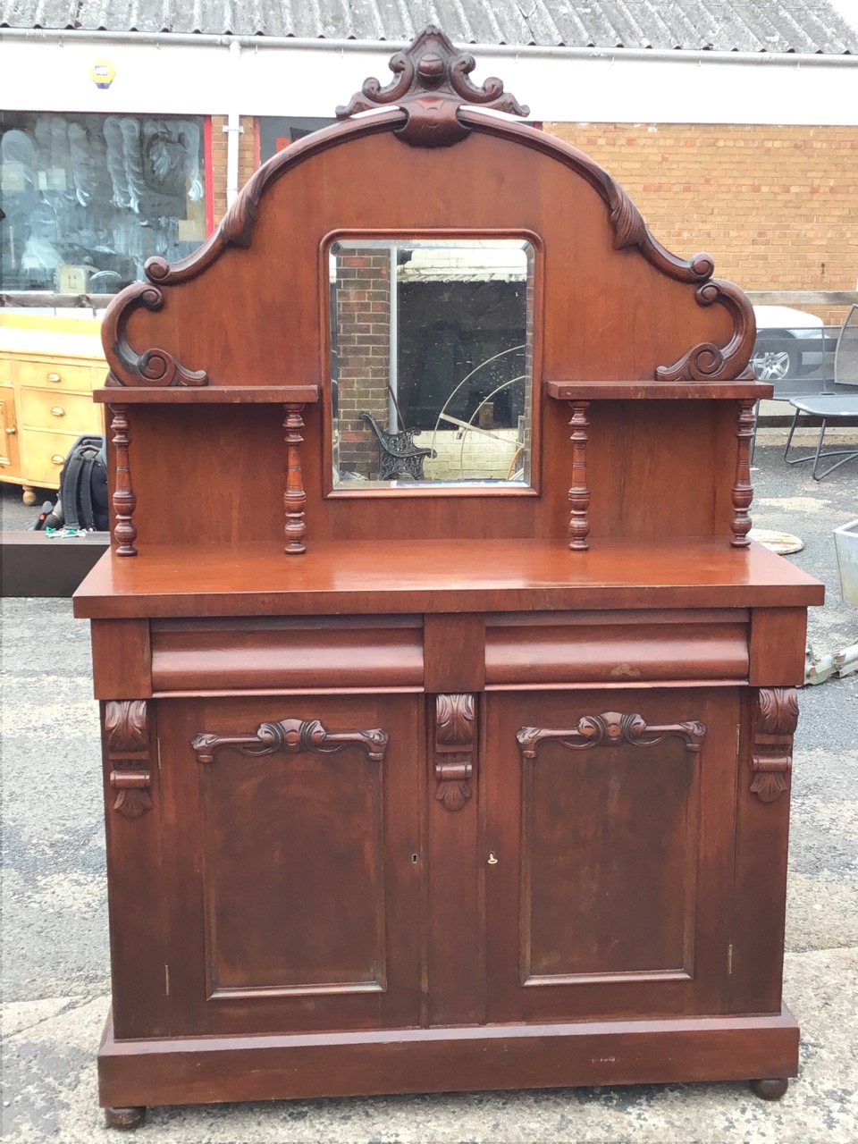 A Victorian mahogany chiffonier with arched scroll carved back having central mirror flanked by - Image 2 of 3