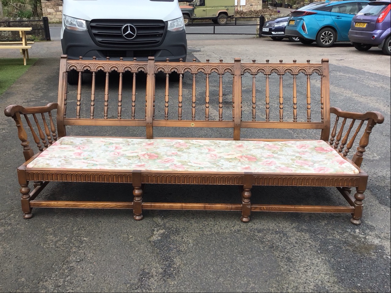 An Ercol elm Old Yorkshire pattern three-seater sofa with turned spindle back with carved - Image 2 of 3