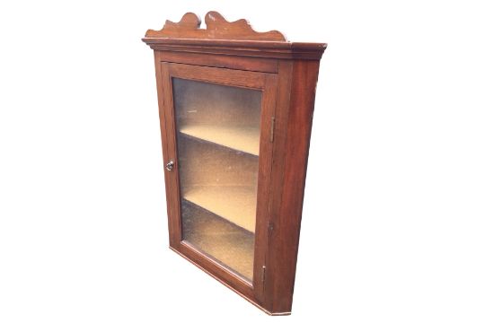 An Edwardian mahogany corner cabinet with shaped pediment and moulded cornice above a brass - Image 1 of 3