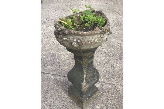 A composition stone garden urn on an associated stand, the D-shaped bulbous pot cast with vines, - Image 3 of 3