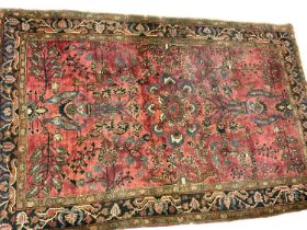 Persian rug, with radiating foliage on claret ground, 202 x 102cm, together with another similar 197