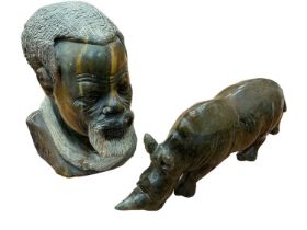 Nigerian greenstone carving of a rhinoceros and a similar bust