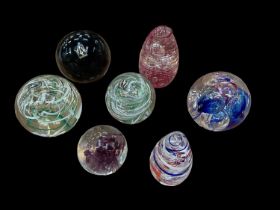 Seven Langham glass paperweights