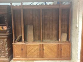 Victorian Gothic taste pitch pine bookcase, with open upper section and cupboards below