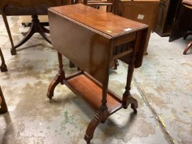 Edwardian mahogany Sutherland table with two flaps and undertier on splayed legs and pair oak chairs