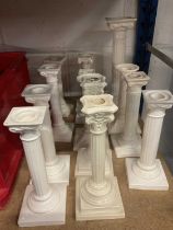 Group of white glazed ceramic candlesticks