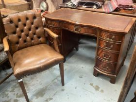 Edwardian-style mahogany serpentine fronted twin pedestal desk, together with a leather studded desk