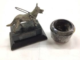 H.M.S. "Lion" vesta holder dated August 6th 1910 and a guide dog trophy (2)