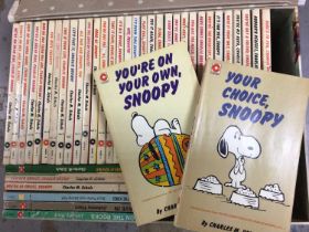 Collection of 37 Charles M Schulz Snoopy books together with three Johnny Hart books (40 total)