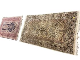 Two Eastern rugs, the largest 134 x 78cm