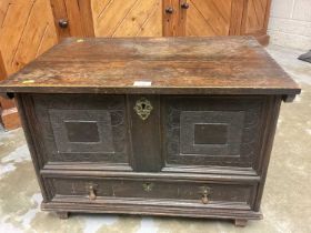 Small 17th century-style oak mule chest with rising top, carved decoration , drawer below with initi